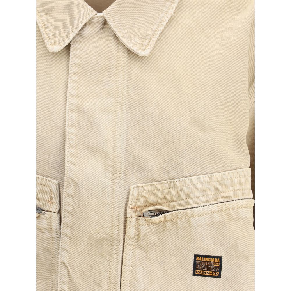 Close-up of Balenciaga Beige Cotton Denim Jacket with collar, zip closure, patch pockets, and logo.