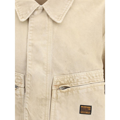 Close-up of Balenciaga Beige Cotton Denim Jacket with collar, zip closure, patch pockets, and logo.