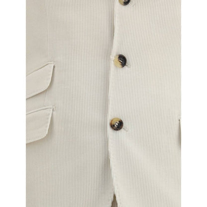 Close-up of Brunello Cucinelli Cream Cotton Two-Piece Suit jacket with button details and flap welt pocket.