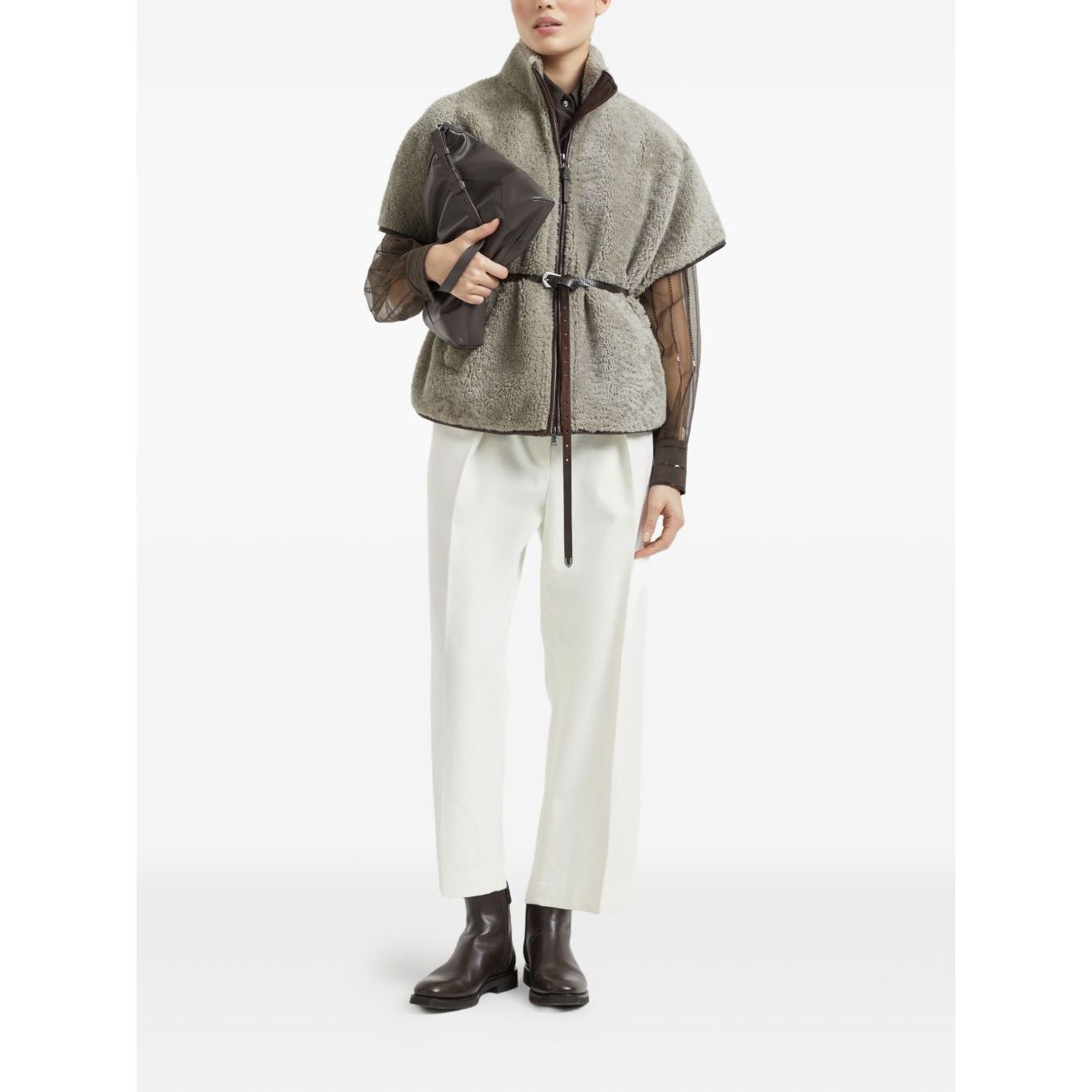 Model wearing Brunello Cucinelli Curly Shearling Short Sleeve Outerwear with Shiny Zipper Pull, displaying chic winter fashion.
