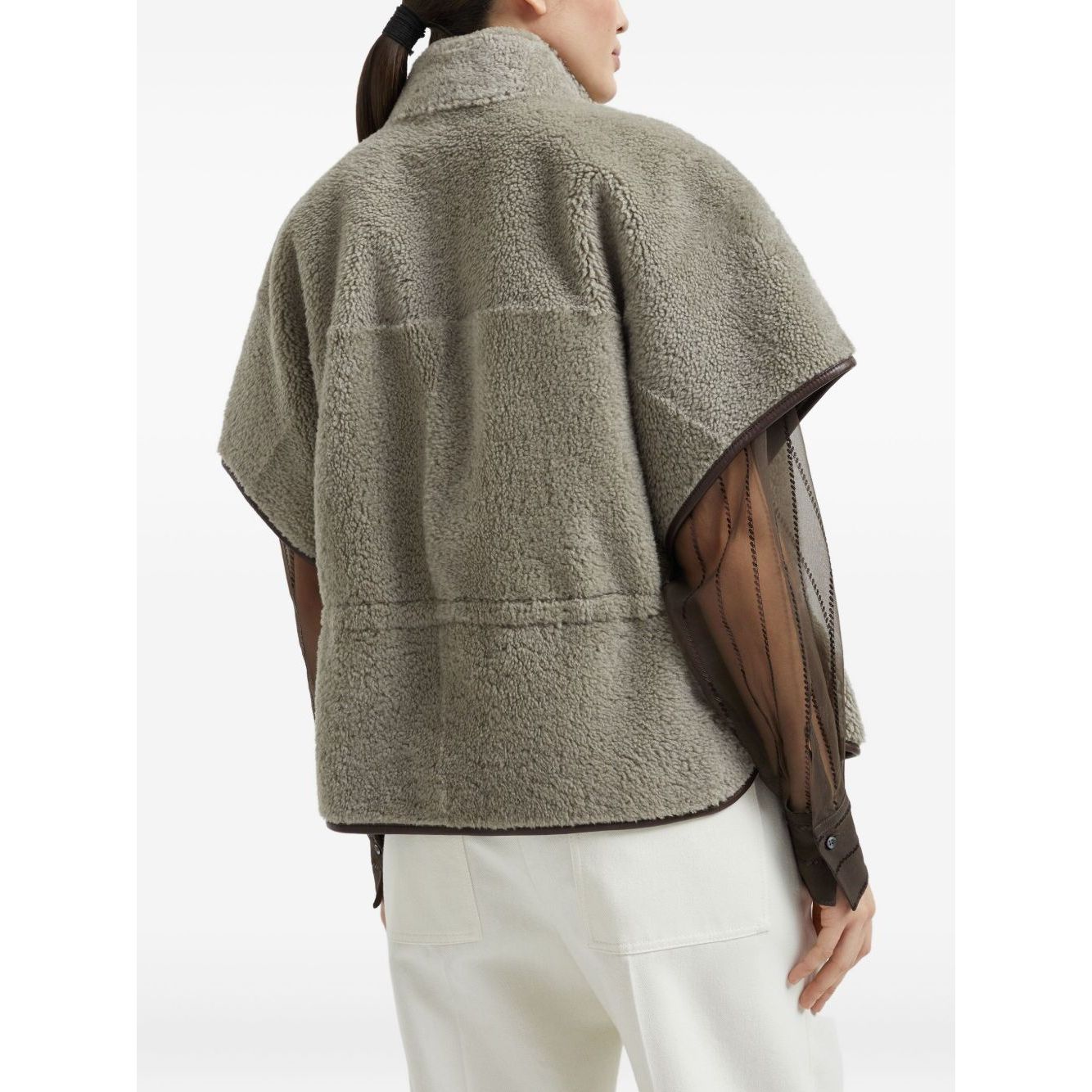 Model wearing Brunello Cucinelli Curly Shearling Short Sleeve Outerwear with Shiny Zipper Pull, back view, size 40 IT.