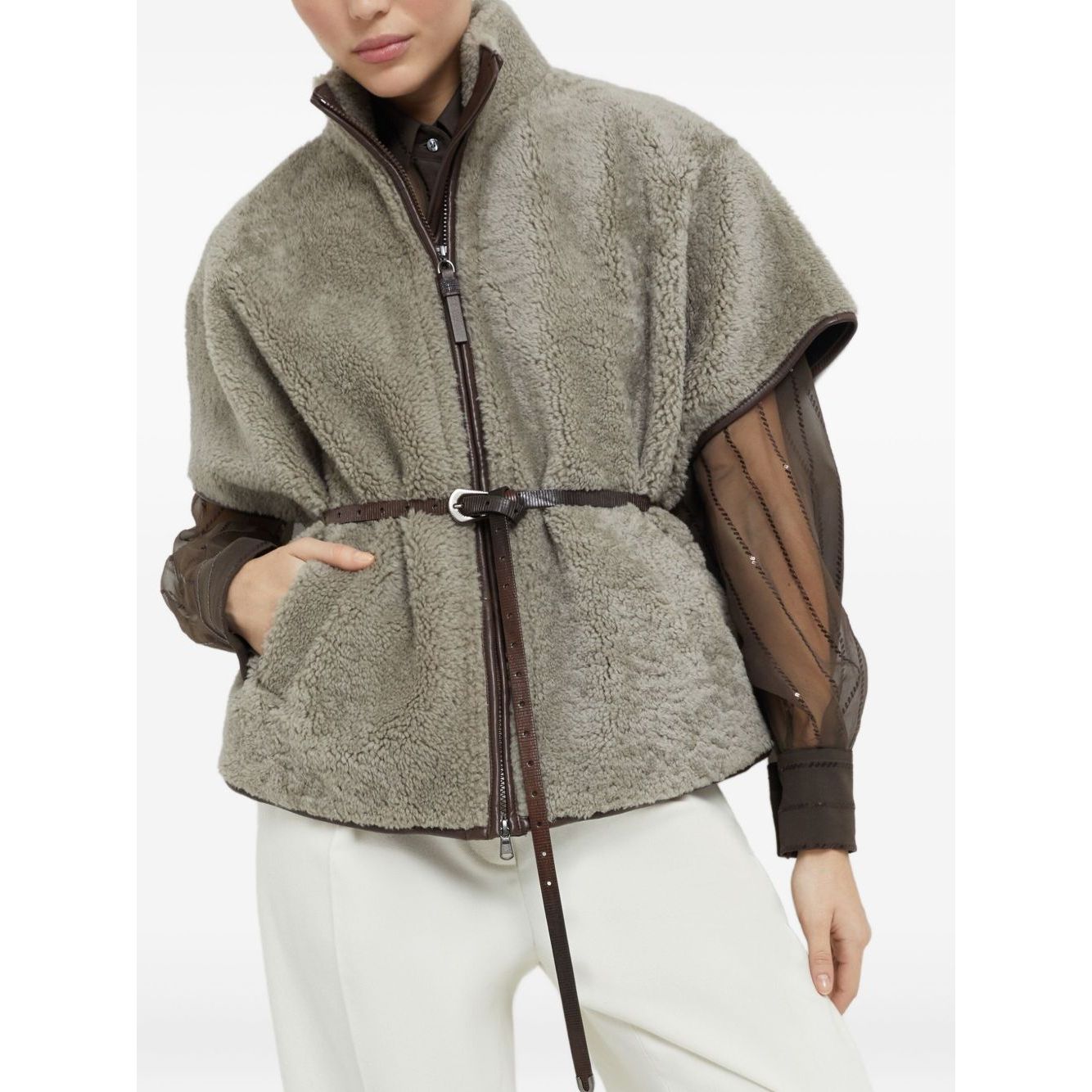 Woman wearing Brunello Cucinelli Curly Shearling Short Sleeve Outerwear with Shiny Zipper Pull, featuring zip fastening and nickel-free monili.