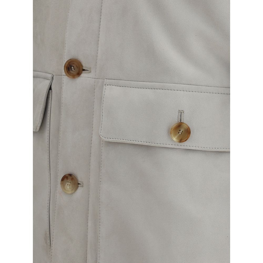Close-up of the Brunello Cucinelli Gray Leather Jacket showing suede texture and button details with patch flap pockets.