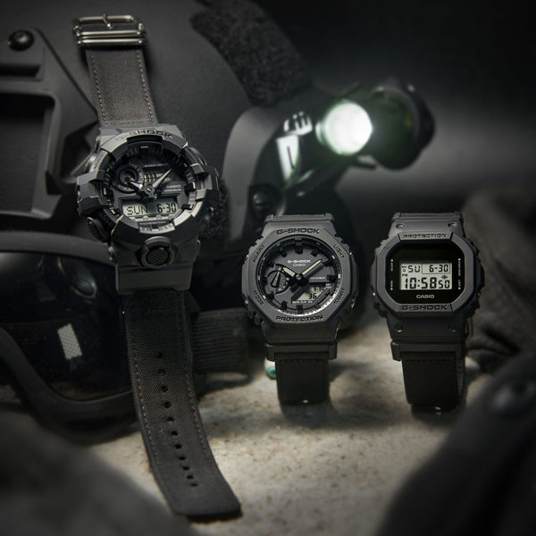 CASIO G-SHOCK Mod. BOLD - BLACK CORDURA ECO FABRIC STRAP SERIE wristwatch displayed with tactical gear.