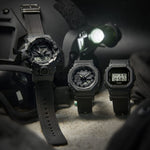 CASIO G-SHOCK Mod. BOLD - BLACK CORDURA ECO FABRIC STRAP SERIE wristwatch displayed with tactical gear.