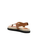 Castañer Castaner Sandals Leather Brown with flat rubber sole and buckle-fastening ankle strap, featuring a cognac brown leather design.