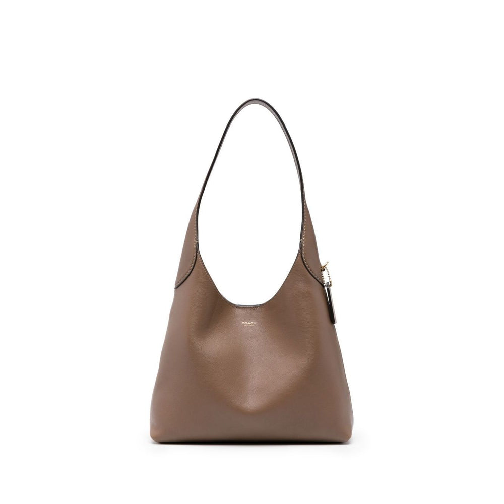 Coach Brooklyn leather hobo bag in light brown calf leather with single shoulder strap and logo pendant, front view