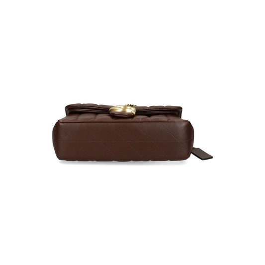 Bottom view of Coach Tabby 26 Shoulder Bag in chestnut brown quilted leather with C logo plaque, featuring foldover top and magnetic fastening.