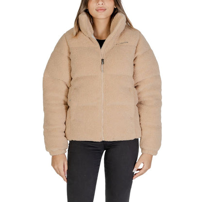 Woman wearing Columbia Beige Nylon Coat with soft Sherpa lining and zip closure, ideal for style and warmth in cold weather.