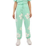 Comme Des Fuckdown Green Cotton Jeans & Pant with prints, elastic waistband, and drawstring, styled with sneakers.