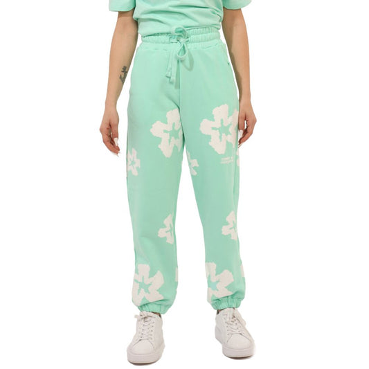Comme Des Fuckdown Green Cotton Jeans & Pant with prints, elastic waistband, and drawstring, styled with sneakers.