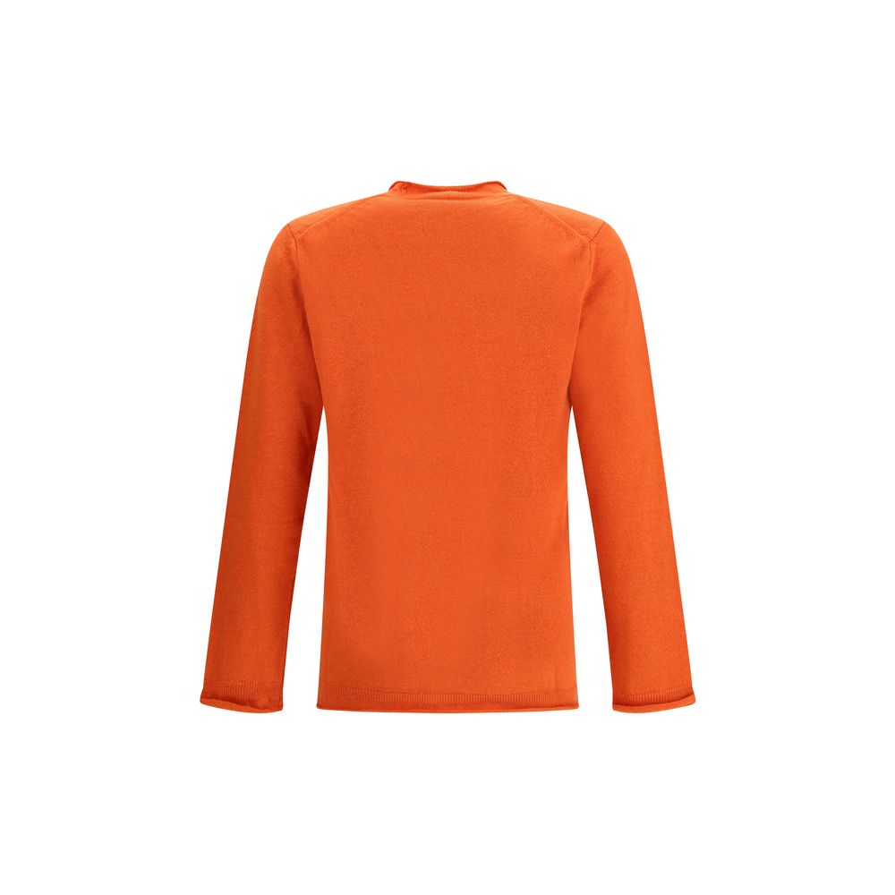 Back view of Comme Des Garçons Orange Wool Sweatshirt with ribbed knit texture, long sleeves, and round neckline, ideal for autumn-winter elegance.