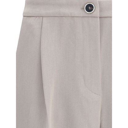 Close-up of Cruna Beige Polyester Casual Pants showing front button detail and side pocket.