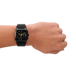 DIESEL Mod. CLIFFHANGER wristwatch on wrist with black leather strap and brown IP stainless steel case, featuring quartz movement and water resistance.