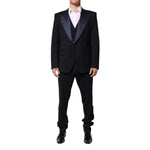 Dolce & Gabbana Black 3 Piece Wool Silk Blend Suit SICILIA with satin peak lapels, modeled for formal occasions and weddings.