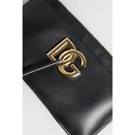 Dolce & Gabbana Black Calfskin Leather DG Logo Women Card Holder Wallet with zipper and logo engraved metal hardware.