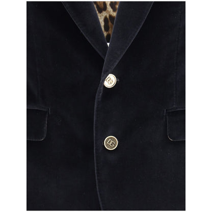 Dolce & Gabbana Black Cotton Blazer with velvet finish and gold button details, featuring rounded peak lapels for a formal look.