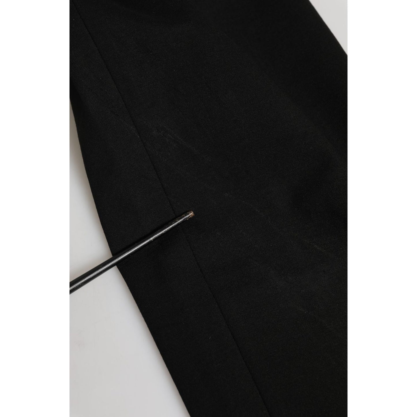 Close-up of Dolce & Gabbana Black Cotton Jogger Jogging Men Trouser Pants showing stain and repaired hole details.