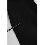 Close-up of Dolce & Gabbana Black Cotton Jogger Jogging Men Trouser Pants showing stain and repaired hole details.