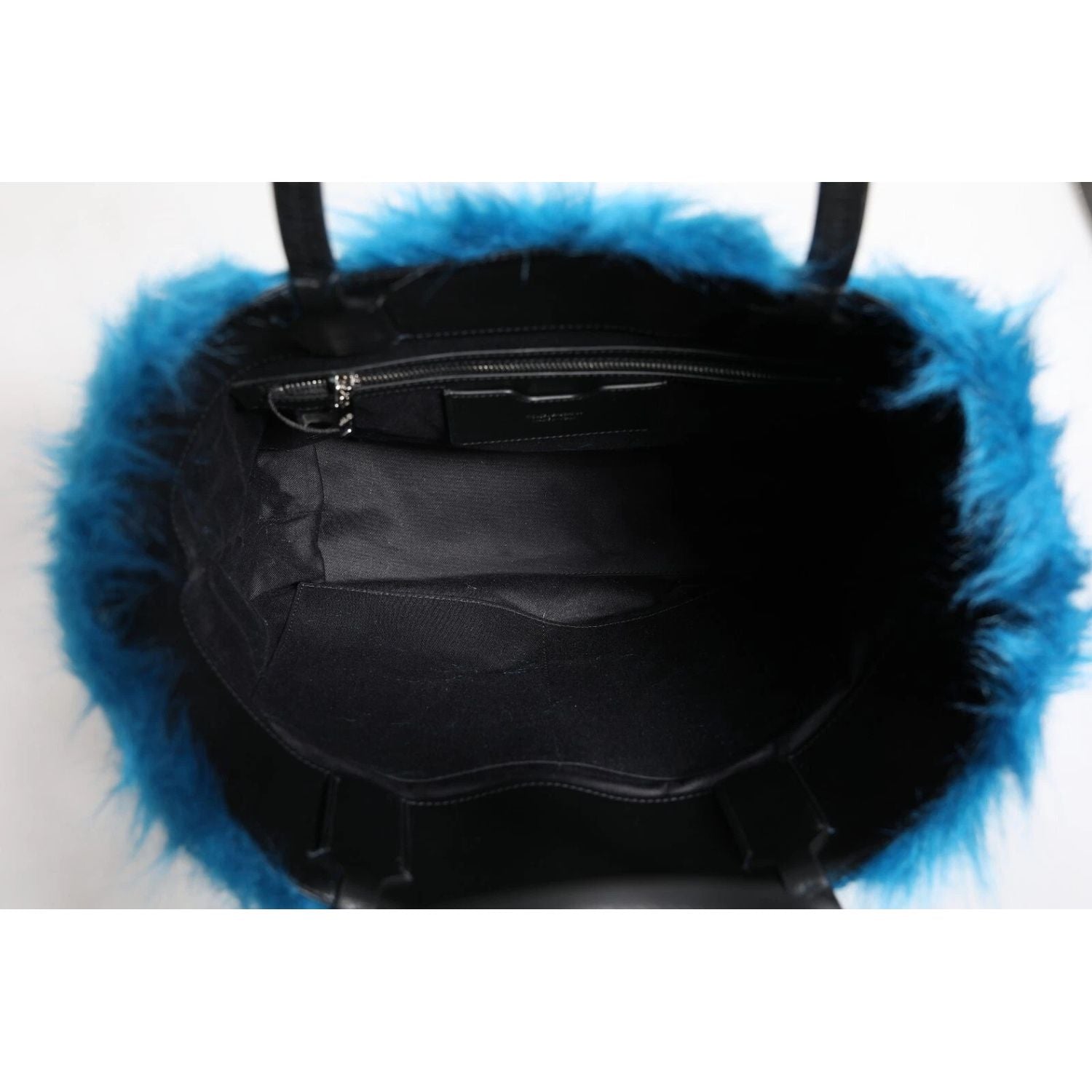 Front view with bag zipped and handles upright.