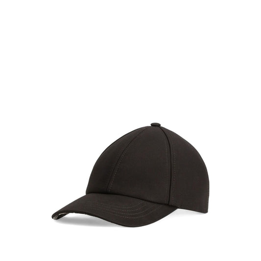 Dolce & Gabbana Cotton baseball cap in black with tonal stitching, curved brim, and adjustable strap featuring logo detailing at the back.