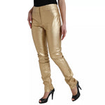 Dolce & Gabbana Gold High Waist Skinny Women Metallic Pants stylish look with minor defects displayed on model.