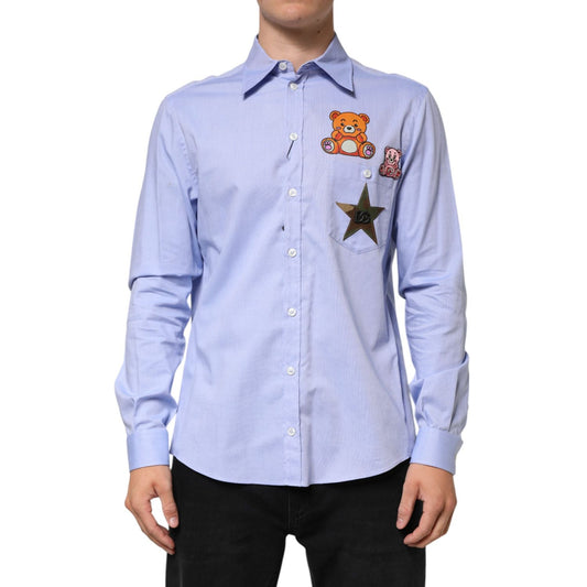 Dolce & Gabbana Light Blue Cotton Teddy Bear Long Sleeve Shirt with playful appliqués, button-up design, 100% cotton, regular fit.