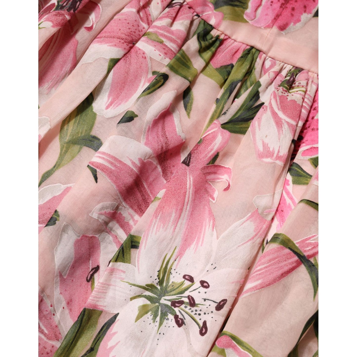 Close-up of Dolce & Gabbana Pink Floral Lily Print Midi Sleeveless Dress fabric with pink lilies.