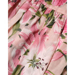 Close-up of Dolce & Gabbana Pink Floral Lily Print Midi Sleeveless Dress fabric with pink lilies.