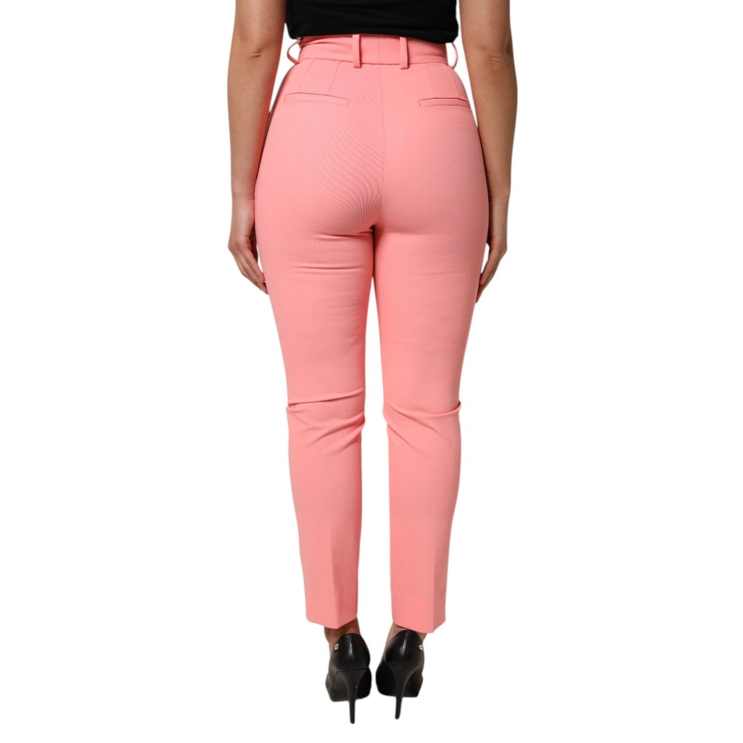 Back view of Dolce & Gabbana Pink High Waist Dress Tapered Trouser Pants showcased on model.