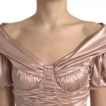 Close-up of Dolce & Gabbana Pink Silk Stretch Sheath Mermaid Gown Dress showcasing elegant off-shoulder detail.