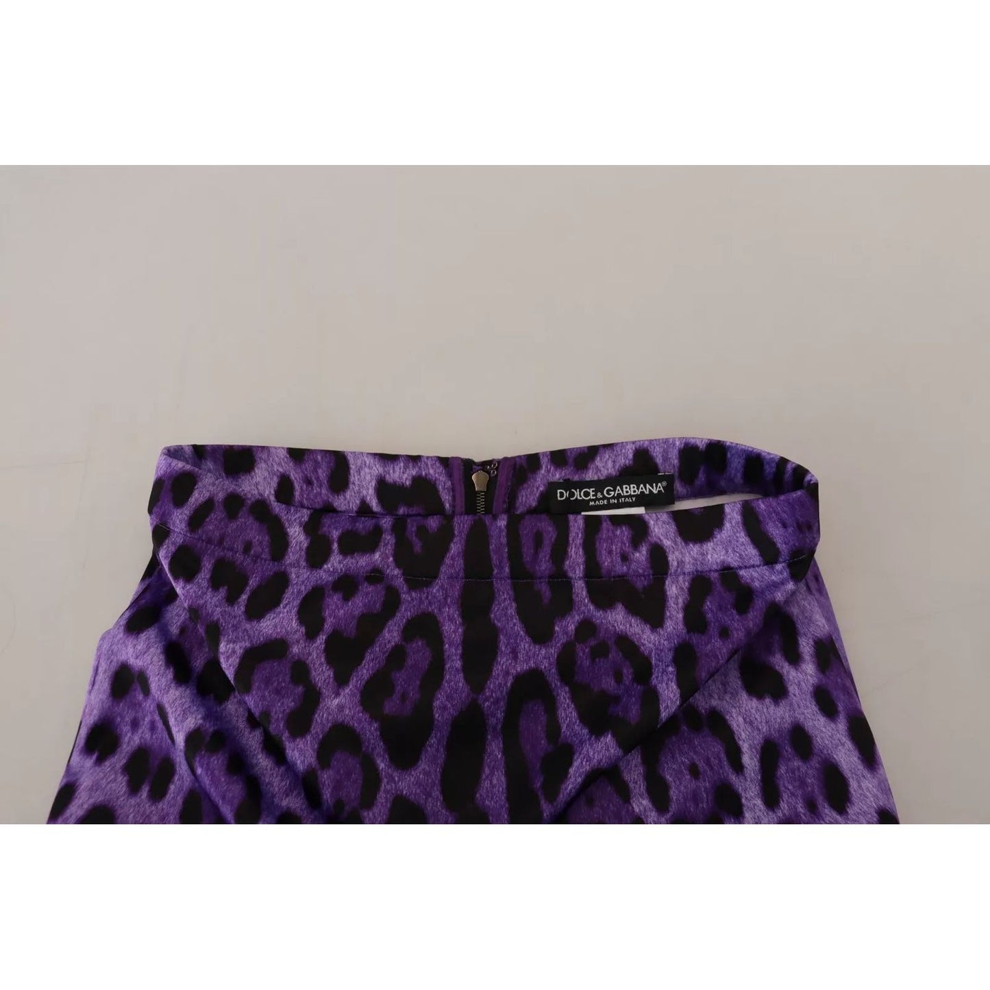 Dolce & Gabbana Purple Leopard Print Pencil Cut Mini Skirt with logo detail and zipper closure on high waist, minor defect visible.