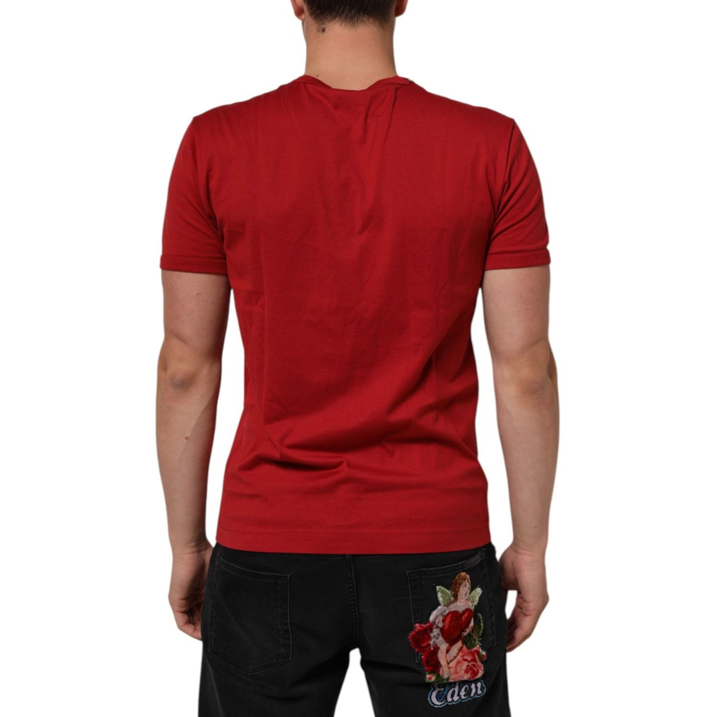 Back view of Dolce & Gabbana Red Crown Bee Cotton Short Sleeve T-shirt on a person, showcasing its bold color and premium fabric.