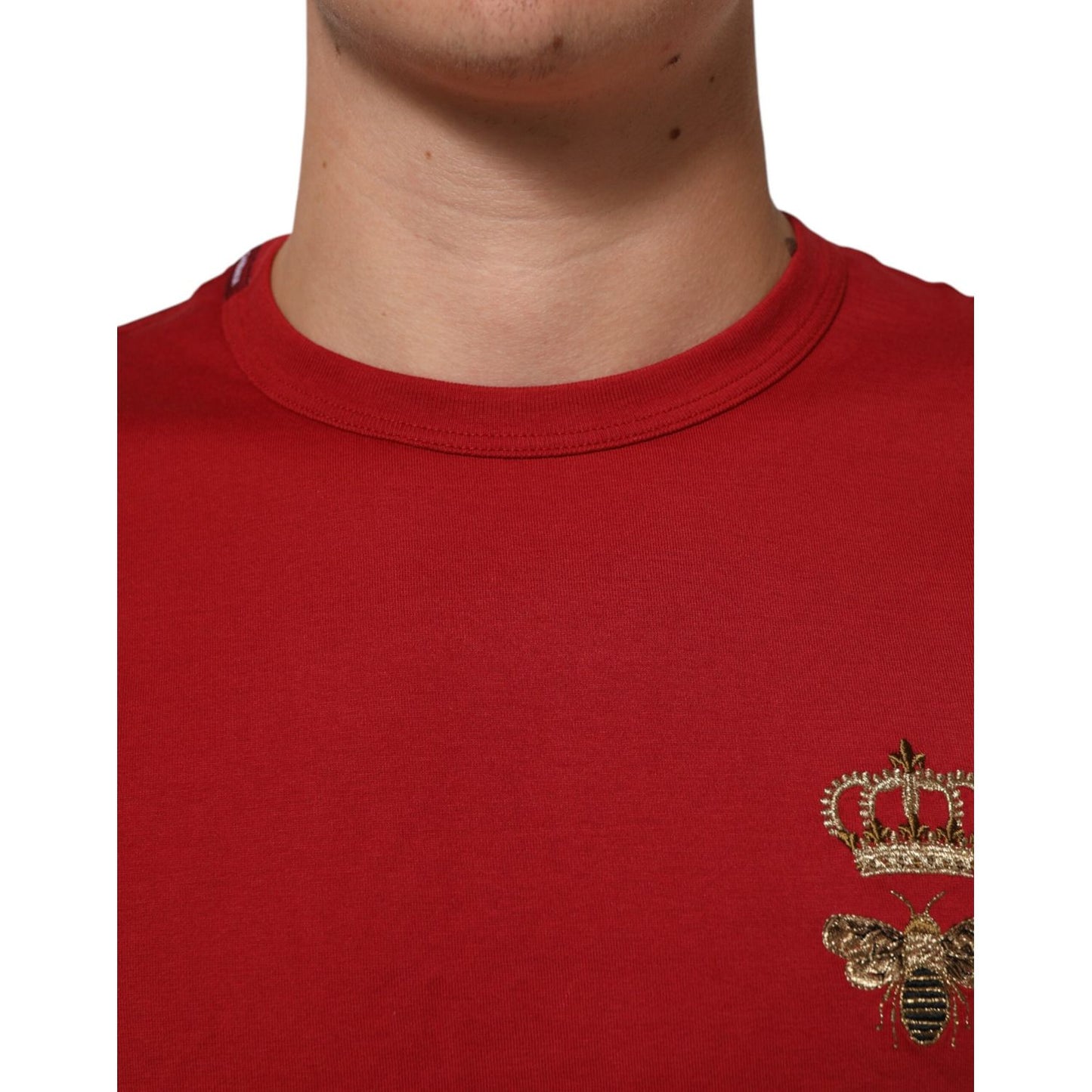 Close-up of Dolce & Gabbana Red Crown Bee Cotton Short Sleeve T-shirt featuring regal bee and crown motif.