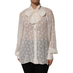 Dolce & Gabbana White Polka Sheer Silk Bow Tie Shirt Blouse Top displayed on a mannequin.