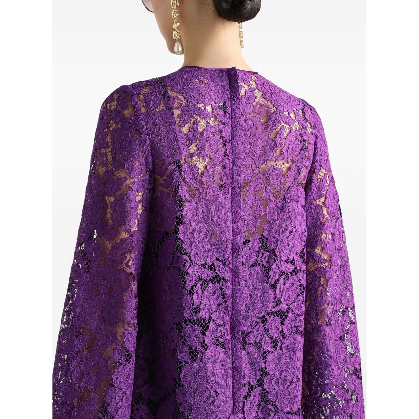 Back view of Dolce & Gabbana bell sleeves Lace mini dress in amethyst purple with rear zip fastening and intricate lace details.