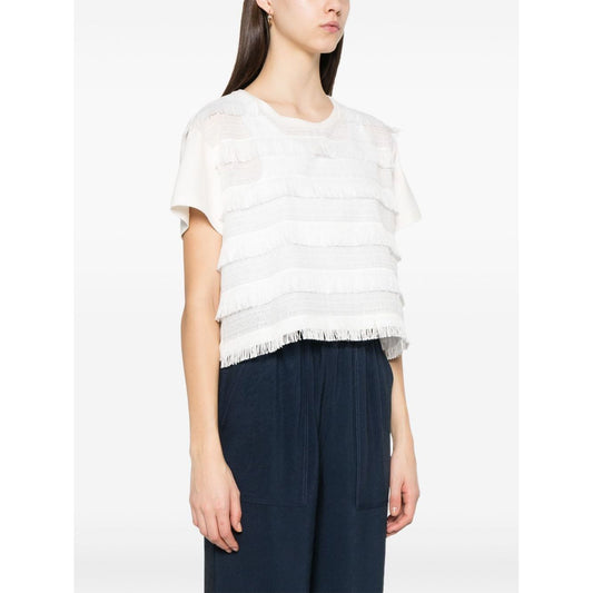 Model wearing Emporio Armani T-shirt with fringes, white crew neck, short sleeves, embroidered logo, cotton fabric, size S.