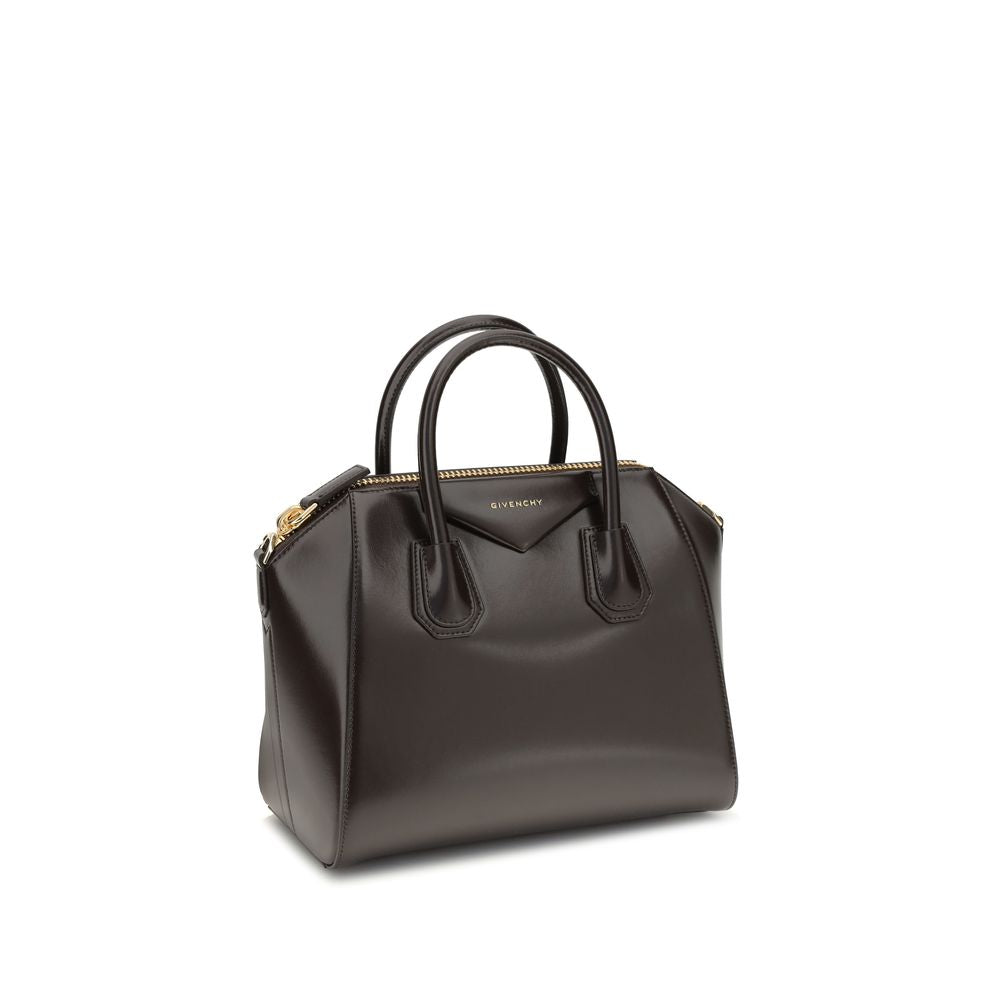 Givenchy Brown Calf Leather Bos Taurus Handbag with glossy finish, features round handles, removable strap, and zipper closure.