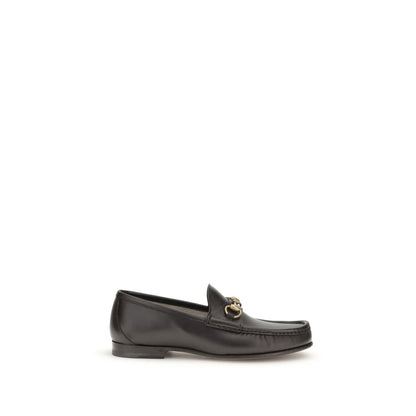 Gucci Brown Calf Leather Bos Taurus Slip-On Loafers with Horsebit detail and gold-tone hardware, part of the 1953 Collection, side view