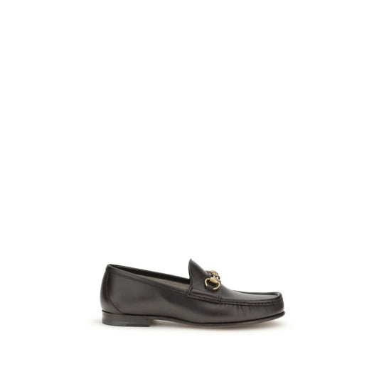 Gucci Brown Calf Leather Bos Taurus Slip-On Loafers with Horsebit detail and gold-tone hardware, part of the 1953 Collection, side view