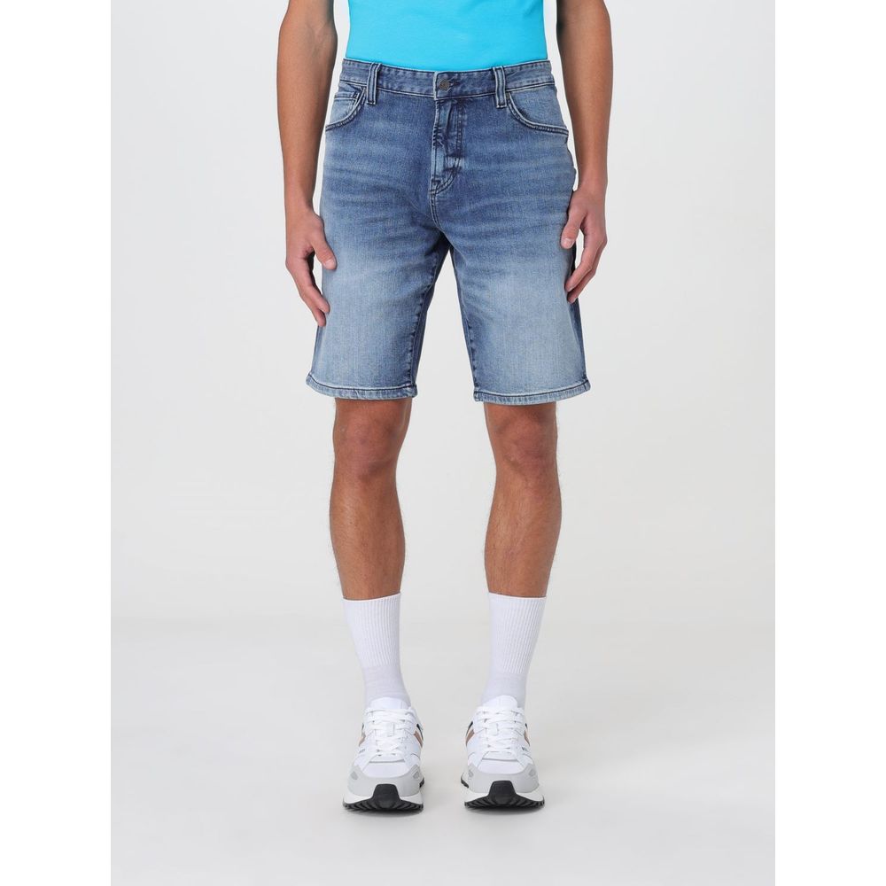 Man wearing Hugo Boss Blue Denim Shorts, size 40, featuring durable denim material and practical pockets, perfect for versatile styling.