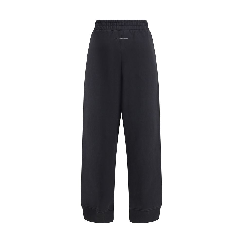 MM6 Black Cotton Joggers (Workout Pants) with elastic waistband, side pockets, and raw-cut slits, showcasing Maison Margiela's style.