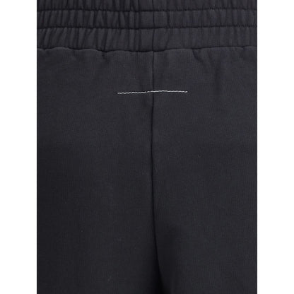 Close-up of MM6 Black Cotton Joggers (Workout Pants) with elasticized waistband and signature logo detail; 100% cotton.