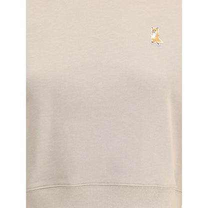 Maison Kitsuné Beige Cotton Sweatshirt with embroidered fox patch detail and ribbed crew neck, hem, and cuffs for a stylish urban look.