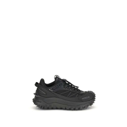Moncler Black Calf Leather Bos Taurus Athletic Sneakers with reflective inserts and embossed logos, featuring drawstring closure and padded design.