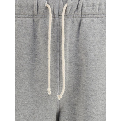 Close-up of New Balance Gray Cotton Joggers (Workout Pants) showing adjustable drawstring and elastic waistband detail.