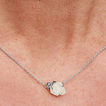 An elegant PANDORA JEWELRY Mod. 393206C01-45 necklace featuring a delicate rose pendant worn on a neck, showcasing sophisticated style.