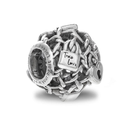 PANDORA Mod. 790071C00 silver charm featuring intricate design, "True Love" engraving, made in Thailand, 925° silver, in official box.