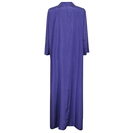 Back view of Parosh Dresses Blue in habotay silk with long sleeves and side slits.