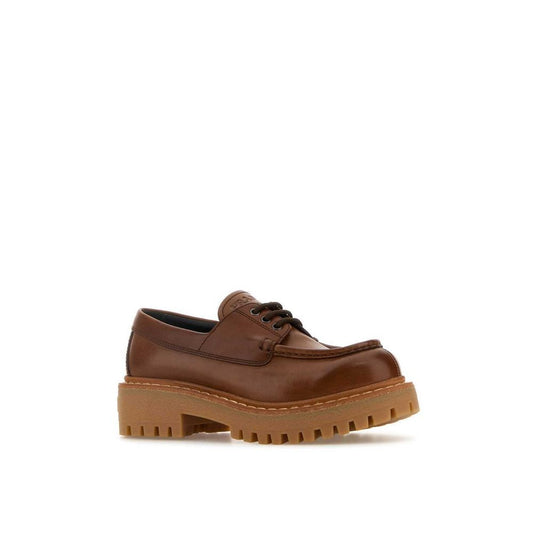 Prada St. Moritz Derby Loafers, 100% calf leather, round toe, lace-up closure, rubber sole, women's shoes, made in Italy.